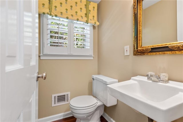 bathroom featuring sink and toilet