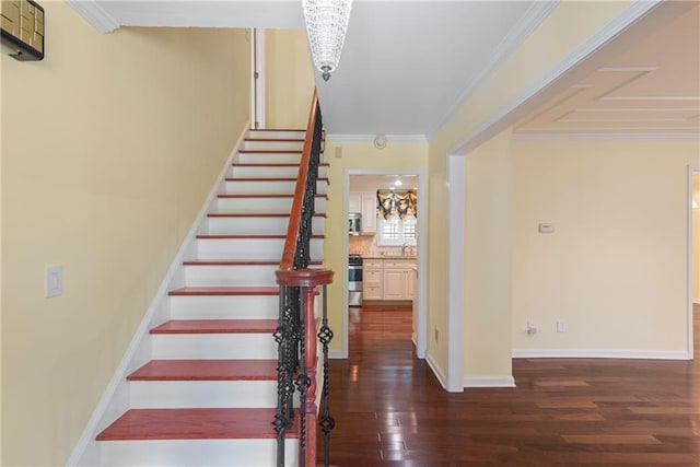 stairway featuring hardwood / wood-style flooring and ornamental molding