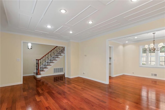 interior space featuring crown molding, a notable chandelier, and dark hardwood / wood-style flooring