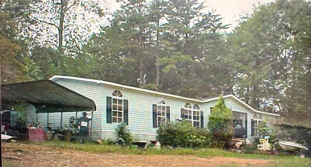 view of front of home with a carport