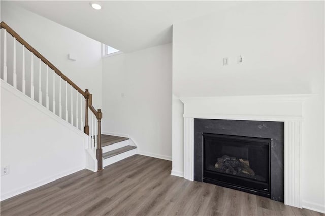 unfurnished living room with hardwood / wood-style flooring