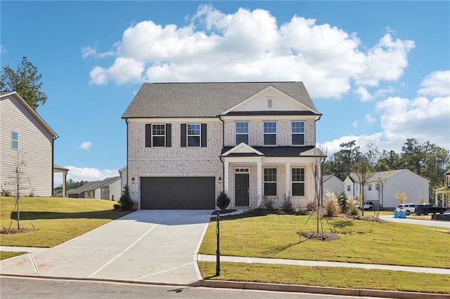 view of front of home with a garage and a front lawn