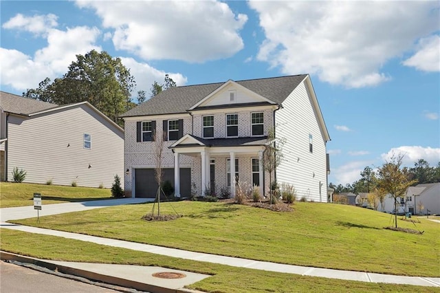 view of front facade featuring a front lawn and a garage