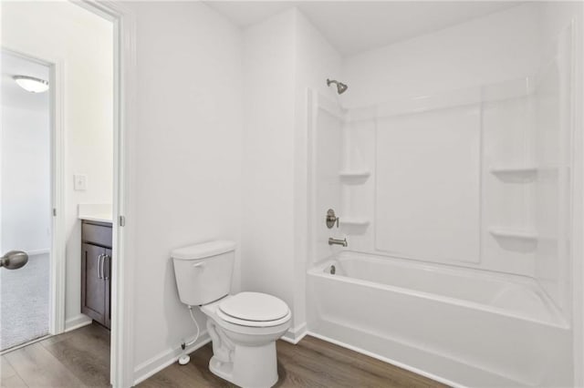 full bathroom with wood-type flooring, vanity, toilet, and shower / bathtub combination