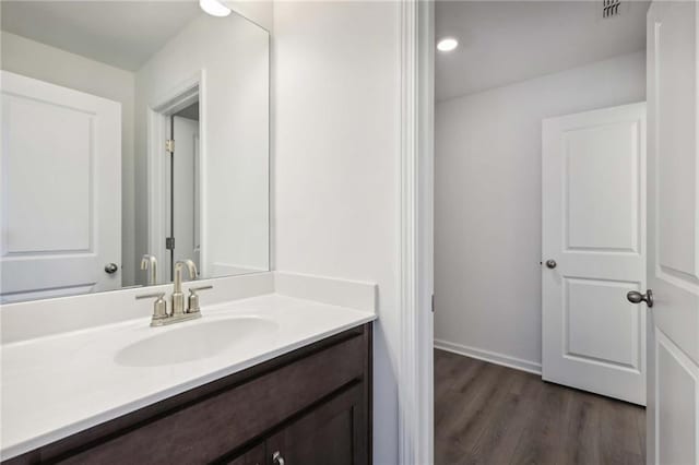 bathroom featuring hardwood / wood-style floors and vanity