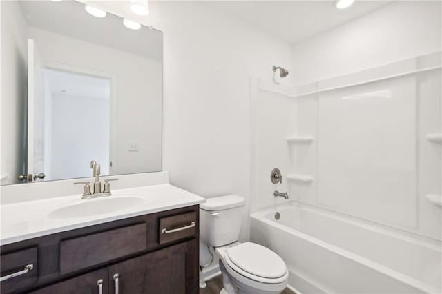 full bathroom featuring vanity, toilet, and bathtub / shower combination