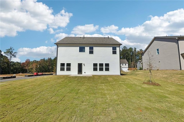 back of house with a yard