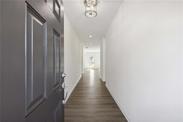 hallway featuring dark wood-type flooring