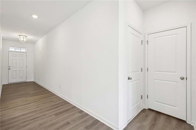 entryway with dark hardwood / wood-style floors