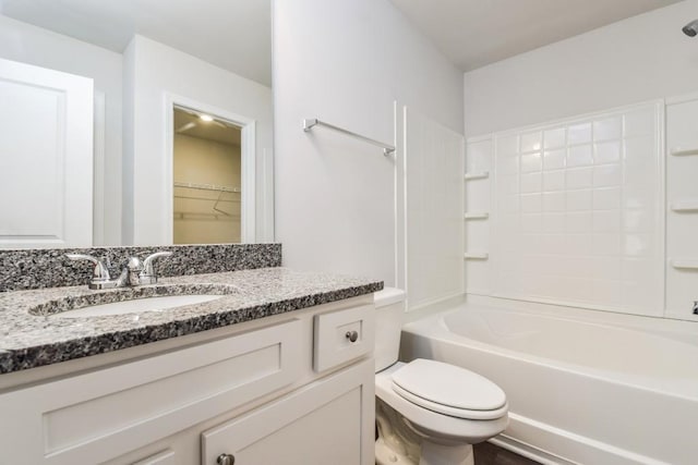 full bathroom featuring shower / bathing tub combination, vanity, and toilet