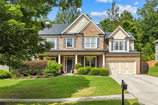 7537 Brookstone Cir, Flowery Branch, GA 30542 - craftsman-style house featuring driveway, brick siding, board and batten siding, an attached garage, and a chimney