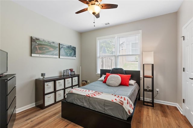 7537 Brookstone Cir, Flowery Branch, GA 30542 - bedroom with light wood-type flooring and ceiling fan