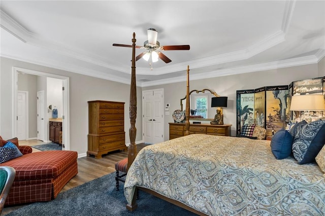 7537 Brookstone Cir, Flowery Branch, GA 30542 - bedroom with a raised ceiling, crown molding, wood finished floors, and a ceiling fan
