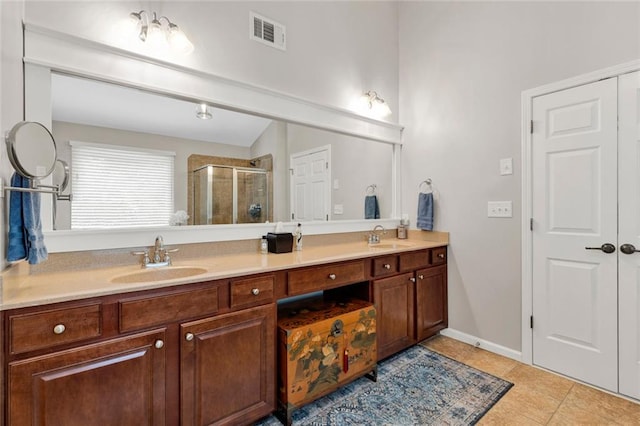 7537 Brookstone Cir, Flowery Branch, GA 30542 - full bath featuring double vanity, a stall shower, and tile patterned flooring
