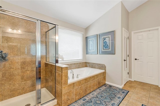 7537 Brookstone Cir, Flowery Branch, GA 30542 - full bath featuring a bath, a stall shower, lofted ceiling, and tile patterned flooring