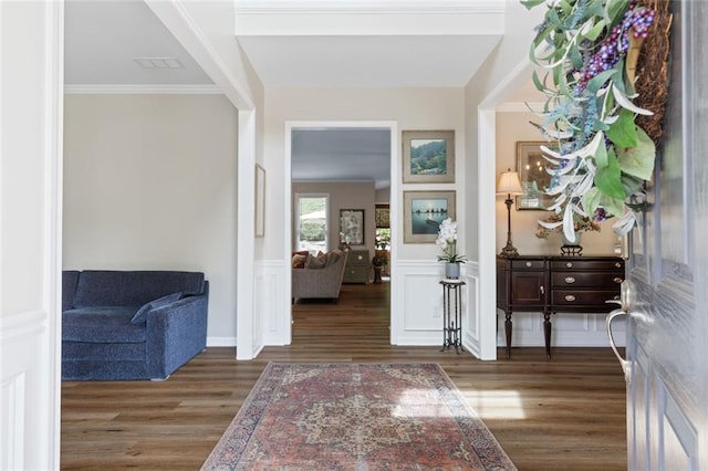 7537 Brookstone Cir, Flowery Branch, GA 30542 - entryway with wood finished floors, a wainscoted wall, and crown molding