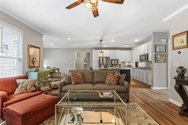 7537 Brookstone Cir, Flowery Branch, GA 30542 - living room with ceiling fan, wood finished floors, crown molding, and recessed lighting