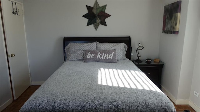 bedroom featuring dark hardwood / wood-style flooring