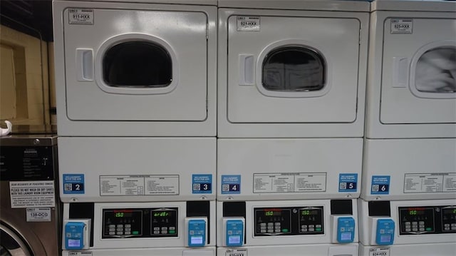 washroom featuring stacked washer and dryer