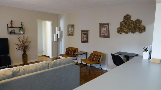 living room featuring dark parquet flooring