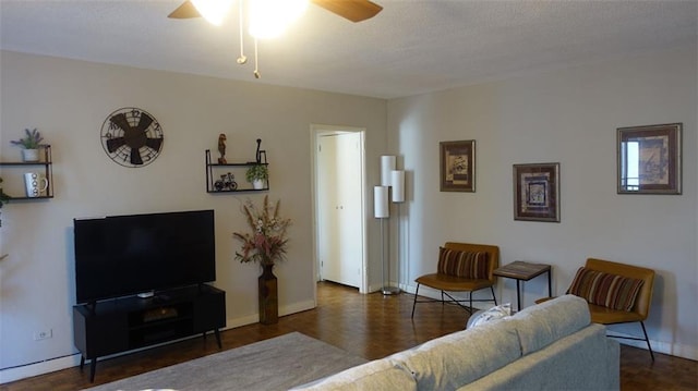 living room with ceiling fan and dark hardwood / wood-style floors