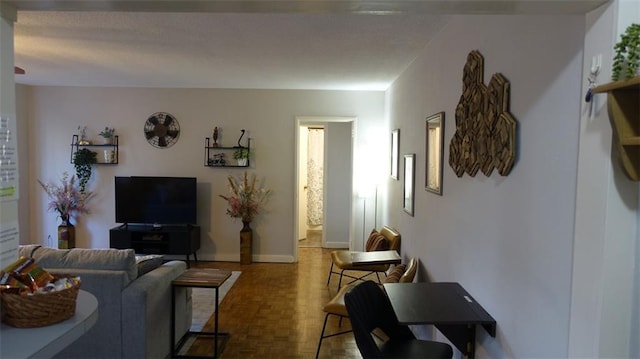 living room featuring parquet floors