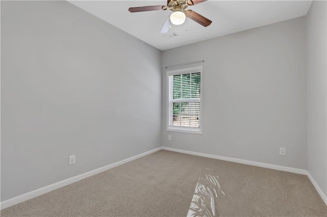 carpeted empty room featuring ceiling fan