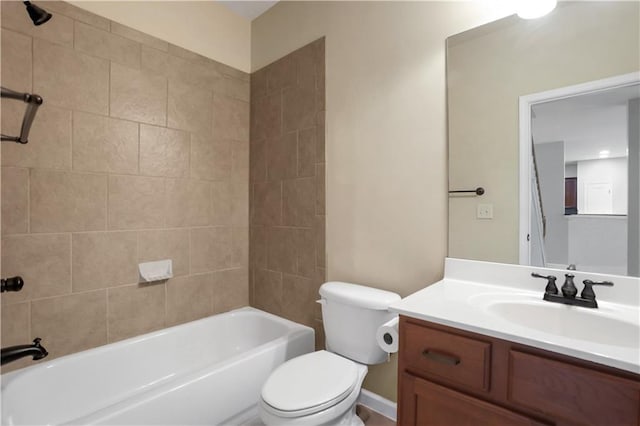 full bathroom with vanity, toilet, and tiled shower / bath