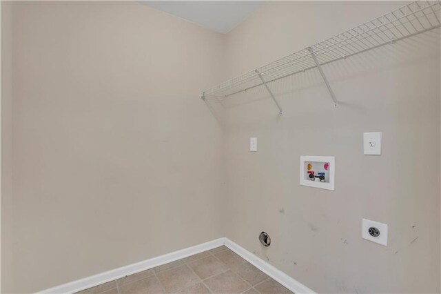 laundry room with hookup for an electric dryer, washer hookup, gas dryer hookup, and light tile patterned flooring