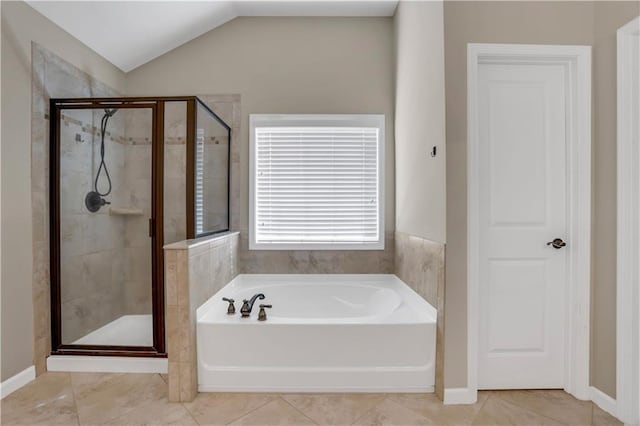 bathroom featuring tile patterned floors, independent shower and bath, and vaulted ceiling