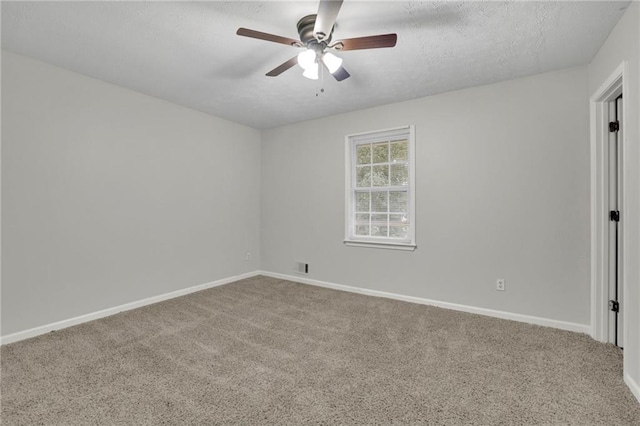 unfurnished room featuring ceiling fan, carpet, and a textured ceiling