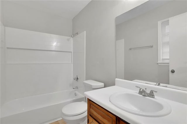 full bathroom with shower / washtub combination, vanity, and toilet