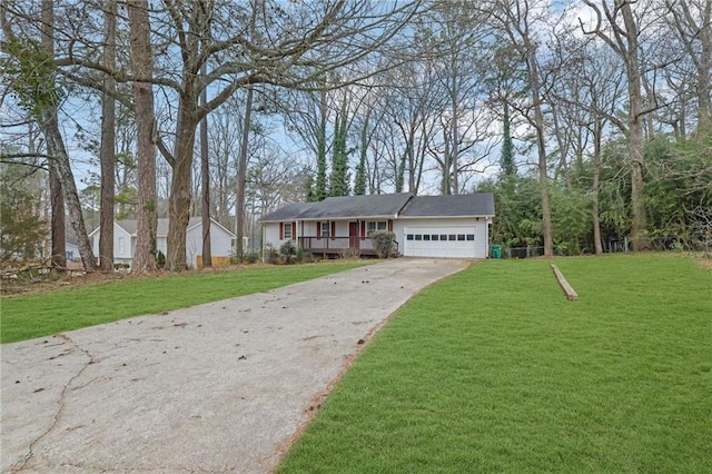 single story home featuring a garage and a front yard