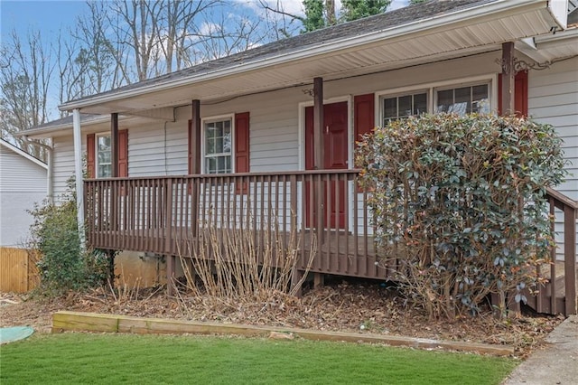 view of exterior entry with a porch