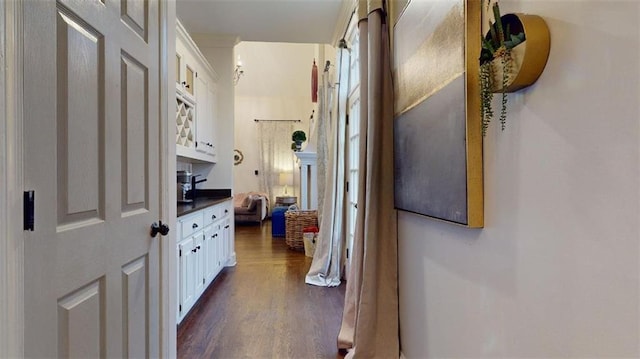 hallway featuring dark hardwood / wood-style flooring