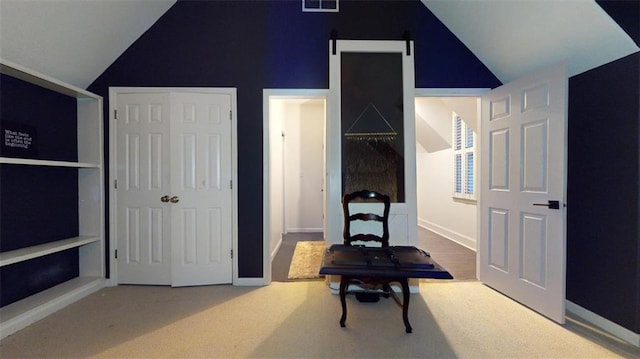 bedroom with vaulted ceiling and carpet