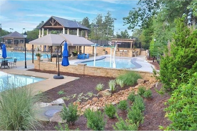 exterior space featuring a pergola, a patio area, and a pool