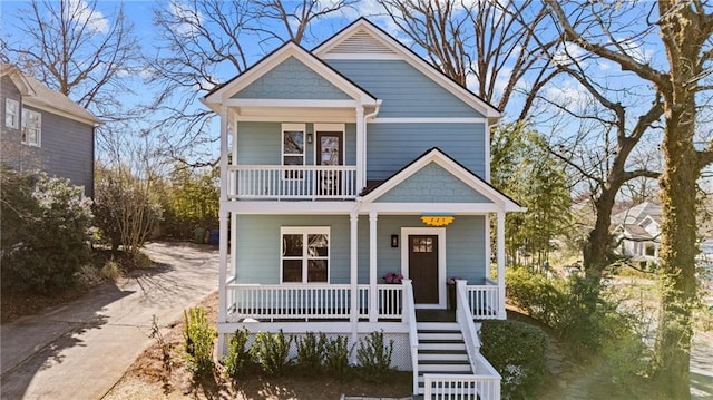 view of front of house with a porch and a balcony