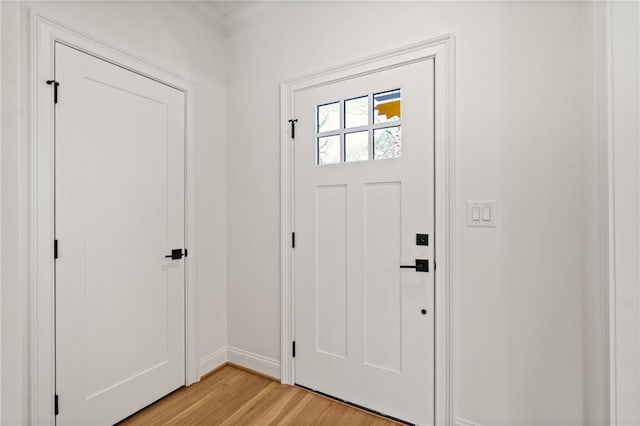 entrance foyer featuring light wood-style flooring and baseboards