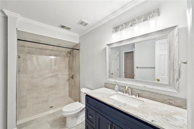 bathroom featuring toilet, visible vents, vanity, a shower stall, and crown molding