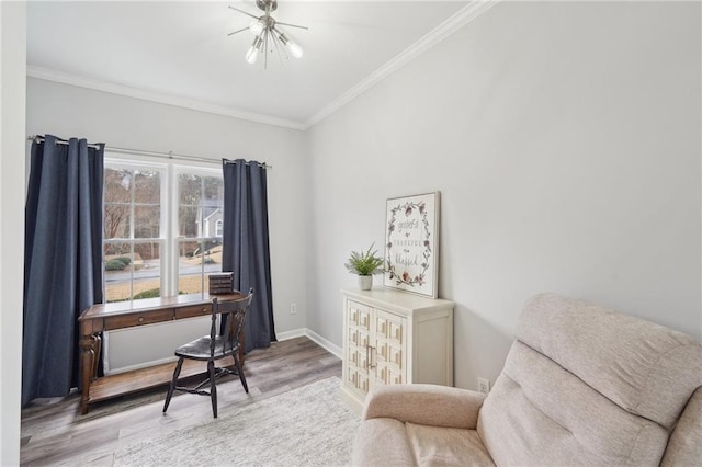 sitting room featuring light wood-style floors, baseboards, and crown molding