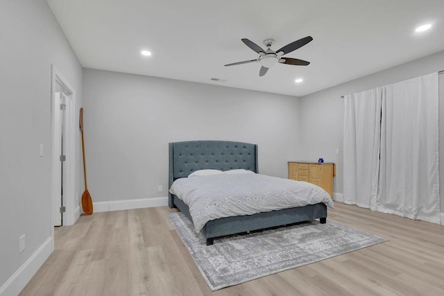 bedroom featuring recessed lighting, baseboards, and light wood-type flooring
