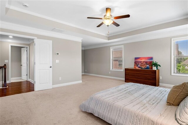5115 Edgebrook Dr, Cumming, GA 30040 - carpeted bedroom featuring a tray ceiling, ornamental molding, and ceiling fan