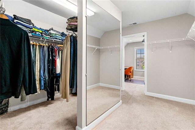 5115 Edgebrook Dr, Cumming, GA 30040 - walk in closet with vaulted ceiling and carpet floors