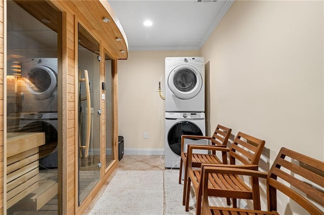 5115 Edgebrook Dr, Cumming, GA 30040 - washroom with stacked washer and clothes dryer, crown molding, and recessed lighting