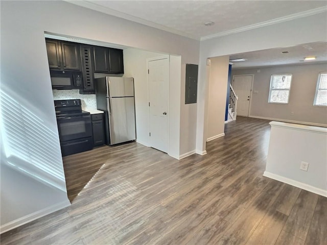 kitchen with crown molding, black appliances, electric panel, hardwood / wood-style flooring, and backsplash