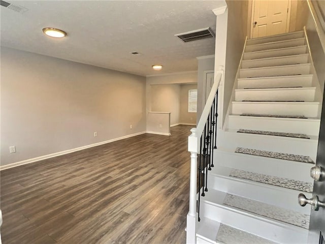 stairway with hardwood / wood-style flooring