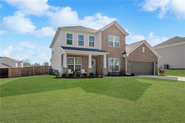 craftsman-style home featuring fence, an attached garage, a front lawn, concrete driveway, and brick siding