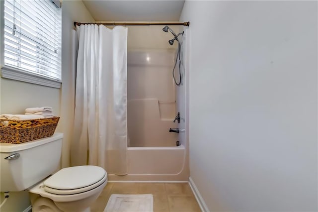 full bath with tile patterned flooring, baseboards, toilet, and shower / bath combo