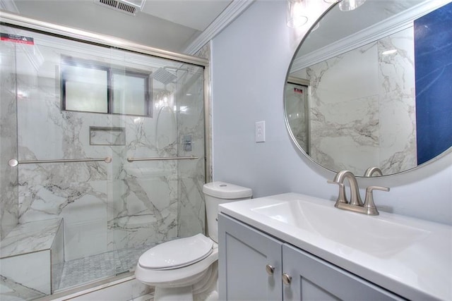 bathroom featuring ornamental molding, vanity, toilet, and a shower with shower door